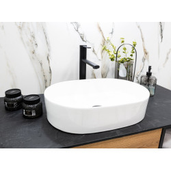 Elegancka umywalka ceramiczna nablatowa Desna 50x35 – biała owalna świetność